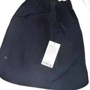 On the fly skirt with tags. Great condition. Too small on me now.